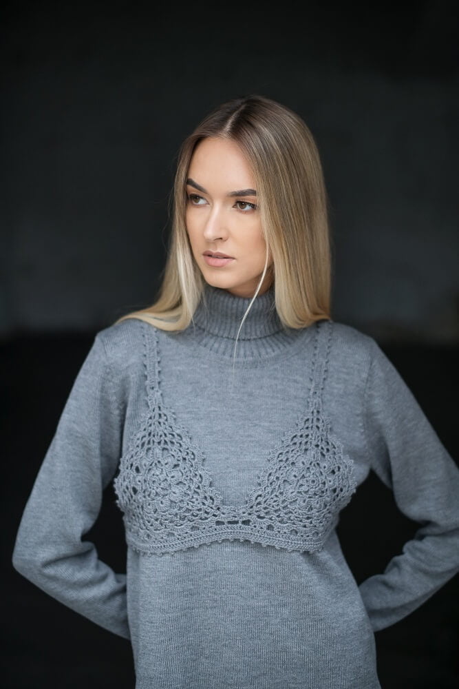 Gray crochet bralette over a matching merino wool turtleneck sweater
