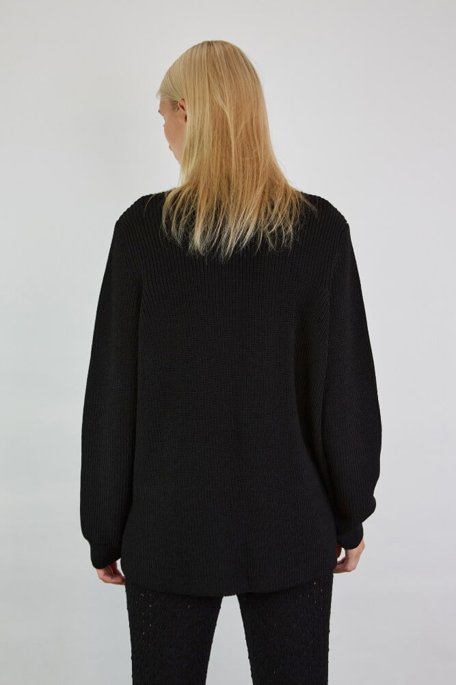 Black merino wool cardigan with ribbed sleeves and front pockets