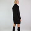 A minimalist set of a merino wool sweater dress and matching leg warmers