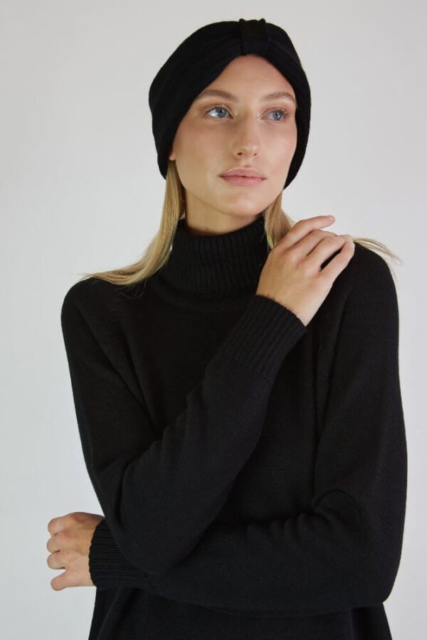 A black set of a headband and a raglan sleeve dress with a roll neck