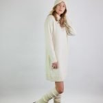 Ribbed merino wool leg warmers with slits worn over matching boots. Paired with a matching raglan sleeve dress