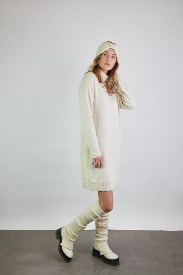 Ribbed merino wool leg warmers with slits worn over matching boots. Paired with a matching raglan sleeve dress