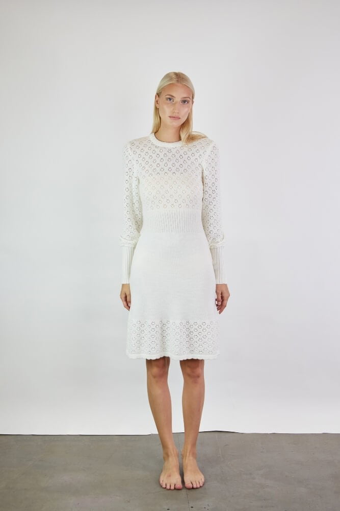 Feminine lace dress in merino wool. A-line skirt