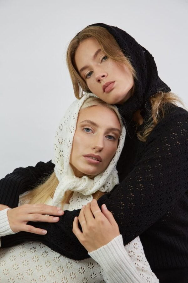 Two girls wearing merino wool lace shawls and merino wool dresses