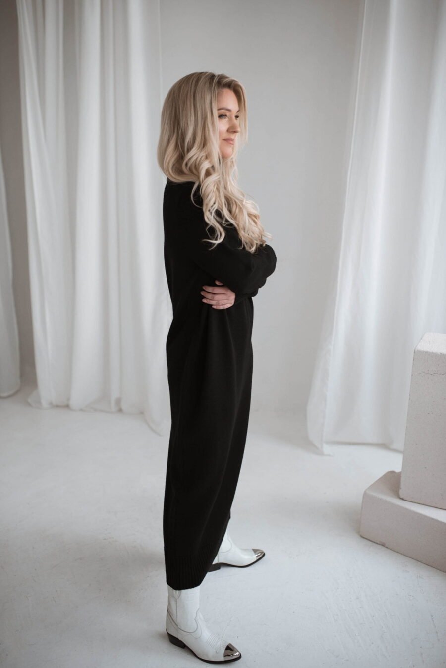 Handmade merino wool dress in a minimalist cut. With a roll neck and long loose-fitting sleeves.