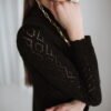 Knit lace pattern blouse with a wavy sleeve cuff