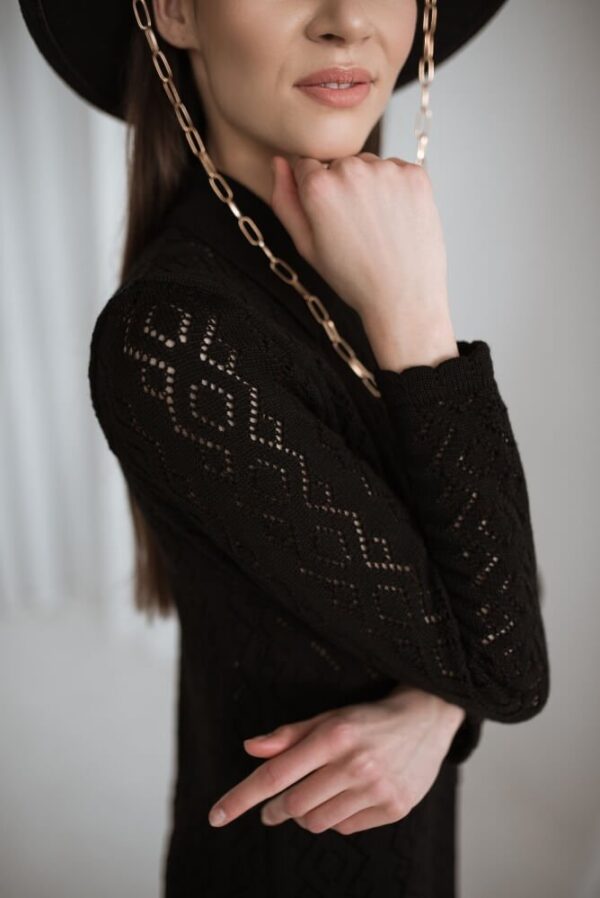 Knit lace pattern blouse with a wavy sleeve cuff