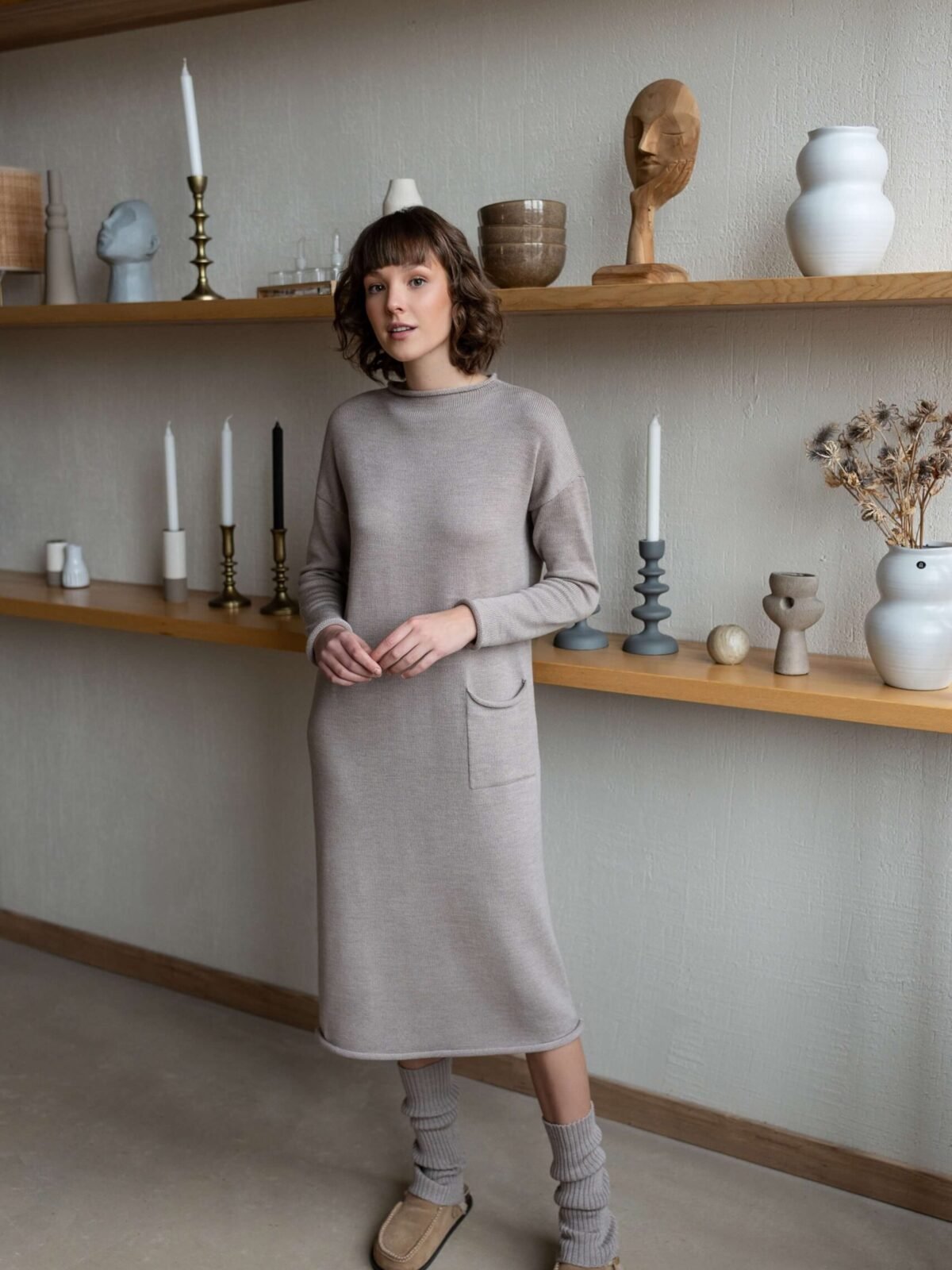 Longline merino wool dress with dropped shoulders and rolling trims