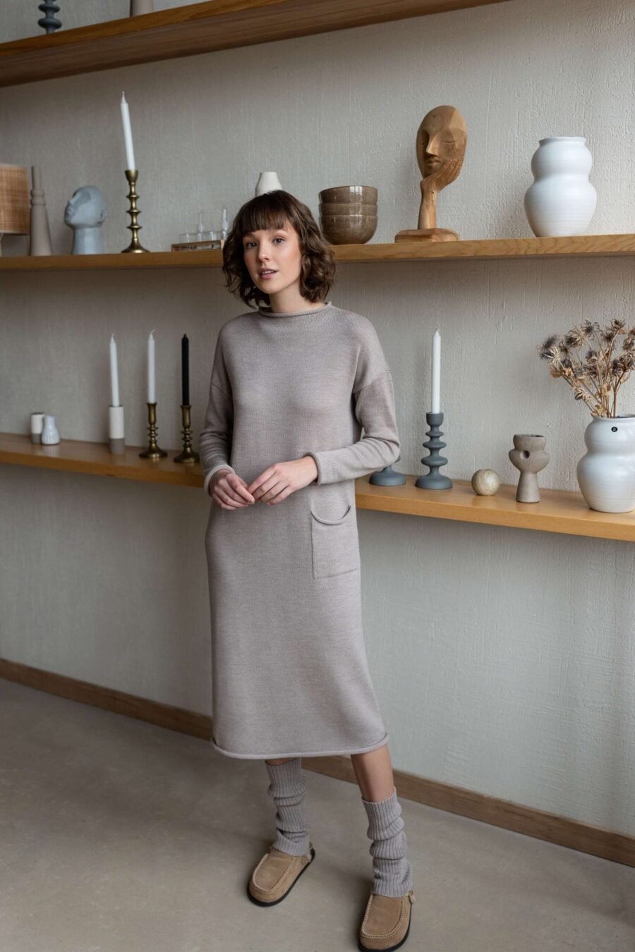 Longline merino wool dress with dropped shoulders and rolling trims