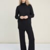 Black merino wool knit set with turtleneck and wide-leg pants