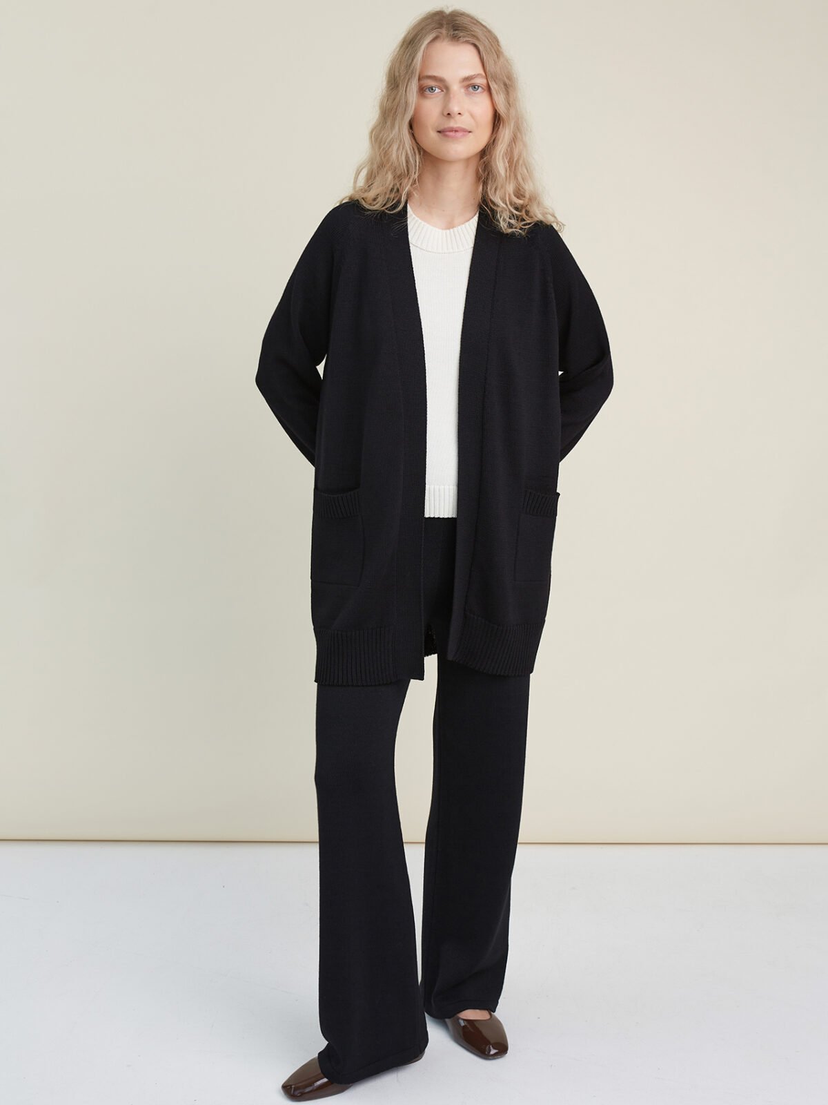 Black knitted merino wool cardigan with pockets